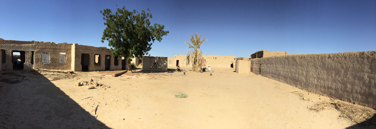 Panoramic view of the area of the temple that is incorporated in the enclosure wall of a modern house